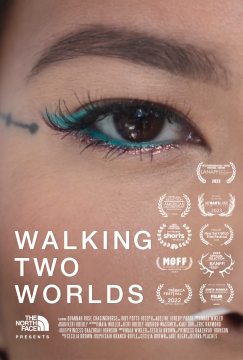 A close-up of a person's eye adorned with blue eyeliner and a small facial tattoo. The poster features numerous film festival accolades and the title "Walking Two Worlds" prominently displayed. The North Face logo appears at the bottom.