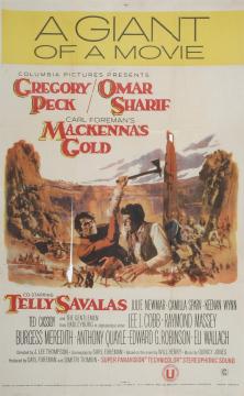 Poster for the film "Mackenna's Gold" featuring Gregory Peck and Omar Sharif raising rifles in a canyon, with mountainous scenery and a golden sky in the background. Film credits and cast listed at the bottom.