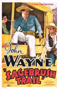 Vintage movie poster for “Sagebrush Trail” shows a cowboy in a blue shirt, another cowboy in white, and a woman looking on. Bold text displays “John Wayne in ‘Sagebrush Trail.’”.