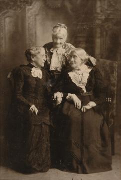 three elderly women conversing