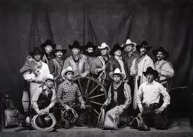 Black and white image of cowboys