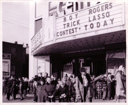 Kids wait outside a theater holding a Roy Rogers Trick Lasso Contest, Roy Rogers and Dale Evans Archives, Library and Archives, Autry Museum; T2010-28.