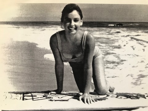 Sepia image of Kathy Gidget Kohner on surfboard