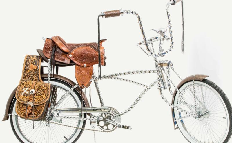 A bicycle made largely of chains with a horse saddle for a seat