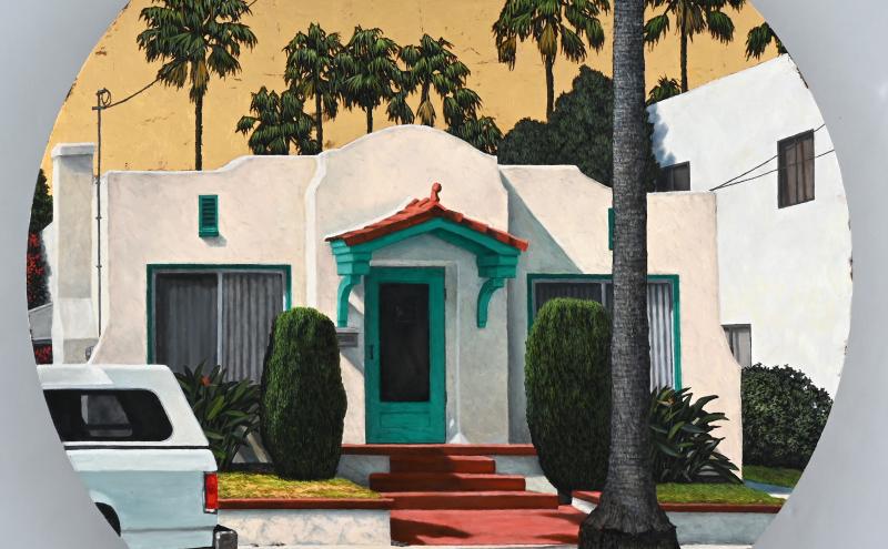 A circular painting of a small white house with a red-tiled roof and teal accents. It has a red pathway, surrounded by trimmed bushes and palm trees. A white vehicle is parked nearby, with a backdrop of tall palms against a beige sky.