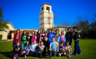 kids posing in front of Autry Museum building
