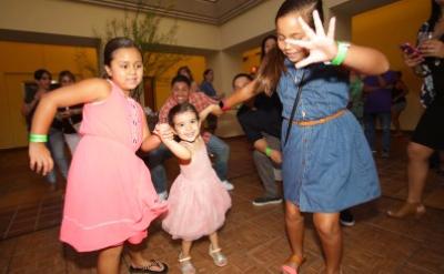 3 young girls dancing on a dance floor