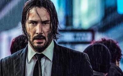 disheveled man standing in the rain