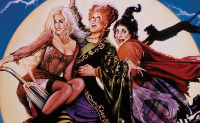 3 witches on a broom stick in front of a full moon