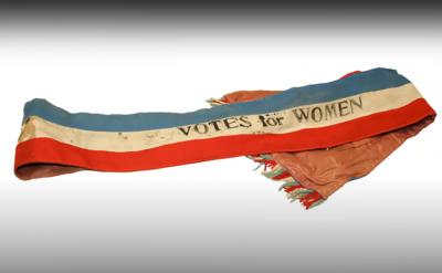 election sash with 'votes for women' imprinted on it