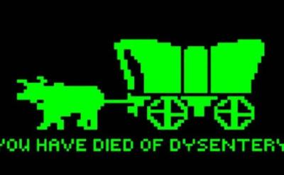 Retro-style pixelated image of a green ox pulling a covered wagon on a black background. The text below reads, "YOU HAVE DIED OF DYSENTERY.