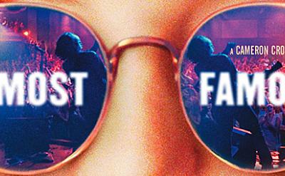 Close-up of sunglasses reflecting a concert scene with the words "ALMOST FAMOUS" across the lenses and "A Cameron Crowe Film" in the background.