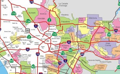Map of Los Angeles County showing various city boundaries in different colors, major freeways in red with green route markers, and labeled cities including Pasadena, Glendale, Burbank, Pomona, and Santa Monica.