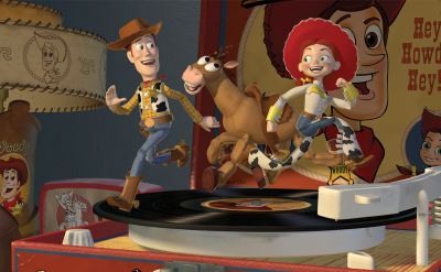 Woody, Jessie, and Bullseye, animated toy characters, joyfully run on a spinning record player. A poster with “Hey Howdy Hey!” and cartoon faces appears in the background, along with cowboy-themed decor.