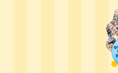 A woman in a colorful dress plays guitar on stage to a large crowd of families and children at an outdoor event. Text says, "Save the Date! Sat, May 16, Sun, May 17, Great Big Family Play Day, The Autry, Los Angeles.