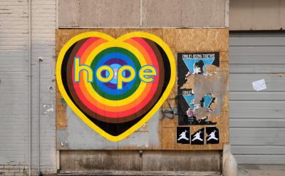 a multi-colored heart icon with the word hope on it