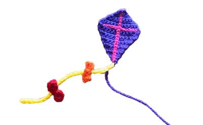 crochet kite made with purple and pink yarn