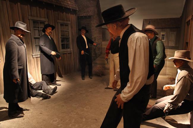 scene of town street with mannequins of men in old west style clothing