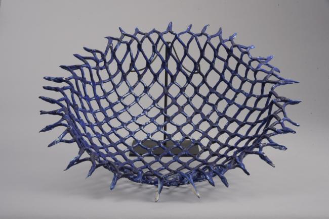 A netlike blue ceramic sculpture