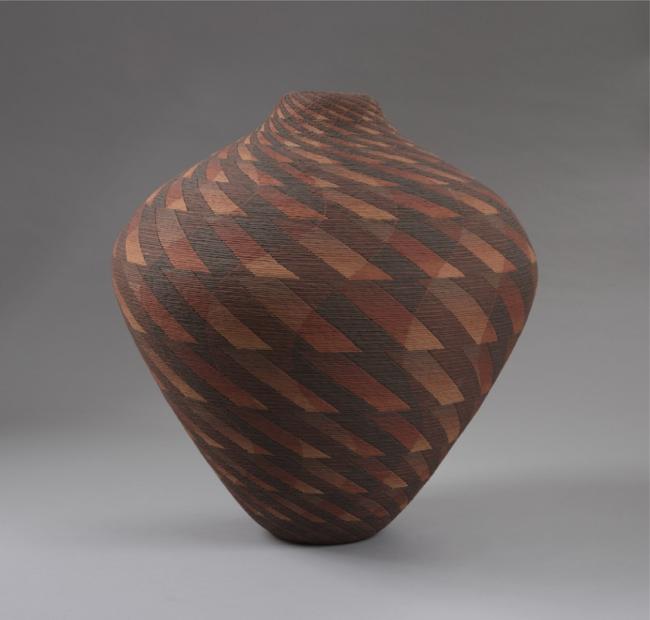 a ceramic vase with abstract patterns