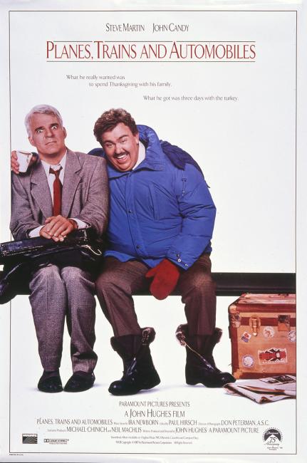 movie poster of two men sitting on a bench, one dressed in casual winter cloths has his arm around the other who is dressed in a suit and appears uncomforable