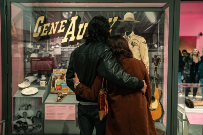 Couple in front of a Gene Autry exhibit