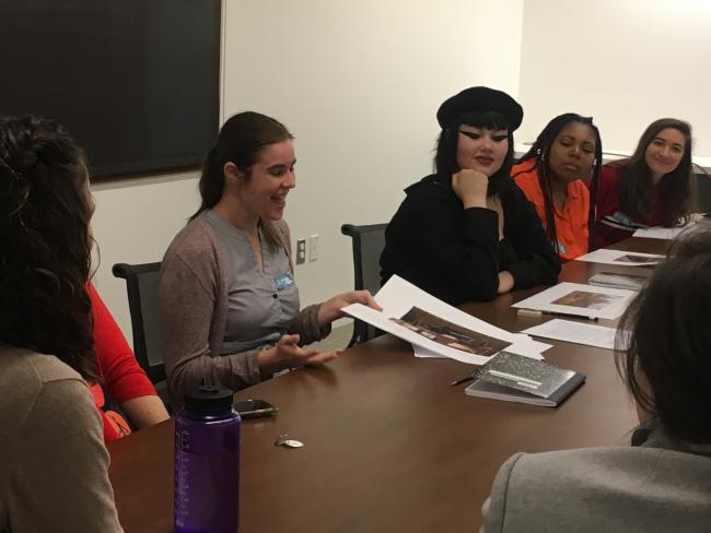 Students at library tables examining archival materials