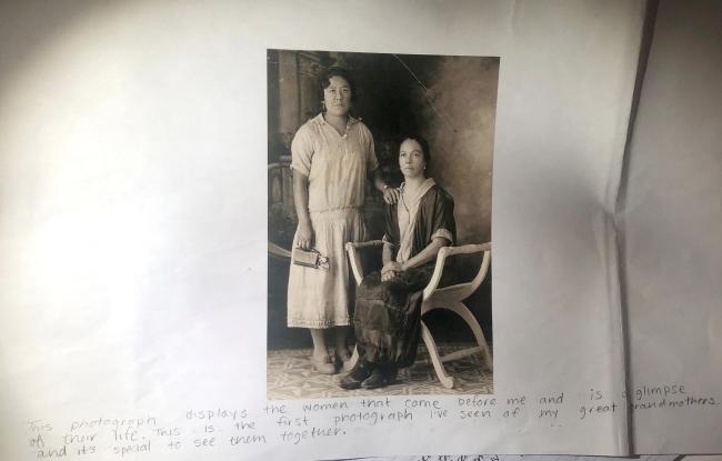 two women one seated dressed in 1920s style casual dresses