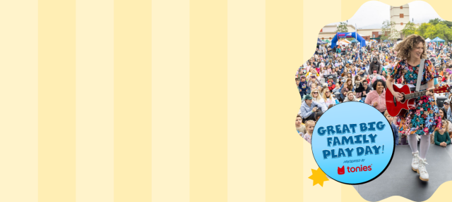 A woman in a colorful dress plays guitar on stage to a large crowd of families and children at an outdoor event. Text says, "Save the Date! Sat, May 16, Sun, May 17, Great Big Family Play Day, The Autry, Los Angeles.