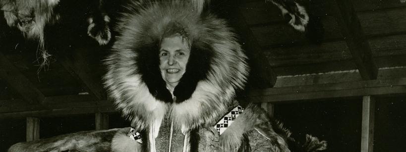 woman dressed in heavy winter coat with fur hood