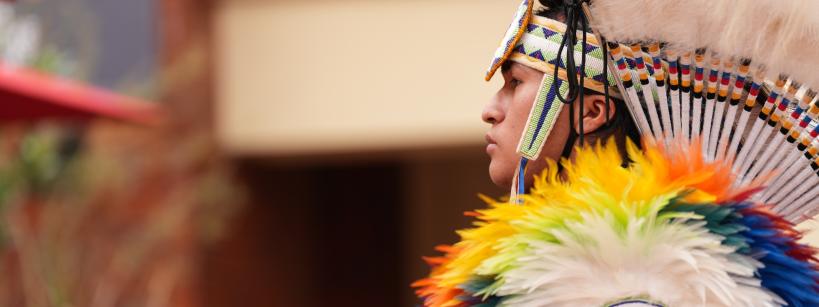 Profile of a Native man dressed in regalia 