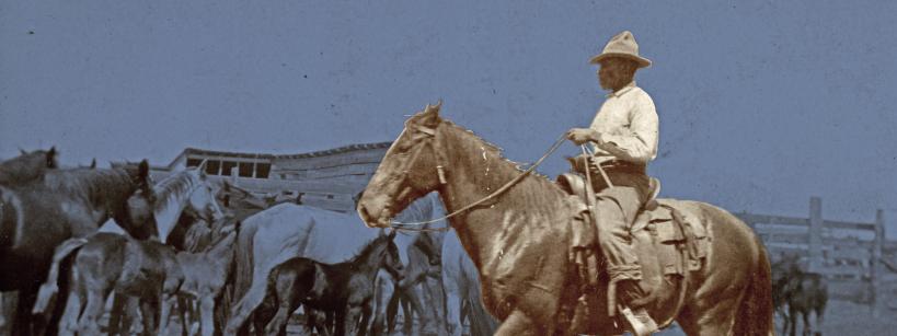 Vintage photo of black cowboy on horse