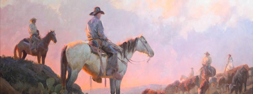 A painting depicts cowboys on horseback herding cattle across a hilly landscape. The scene is bathed in soft pastel colors from the early morning or late afternoon sky, with clouds glowing pink and orange. Cacti and shrubs dot the terrain.