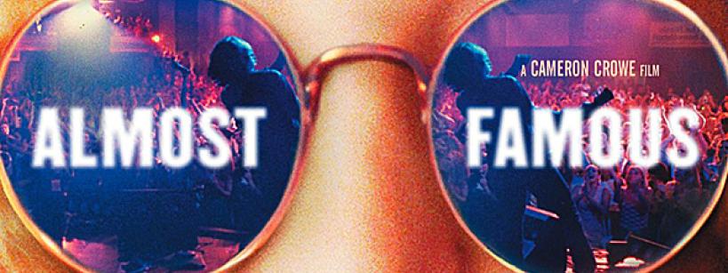 Close-up of sunglasses reflecting a concert scene with the words "ALMOST FAMOUS" across the lenses and "A Cameron Crowe Film" in the background.
