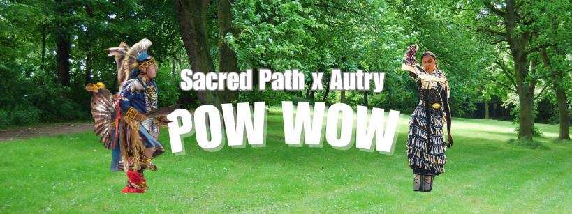 Two Native American dancers in traditional regalia stand on green grass in a park with trees. Bold white text reads "Sacred Path x Autry POW WOW" across the center of the image.