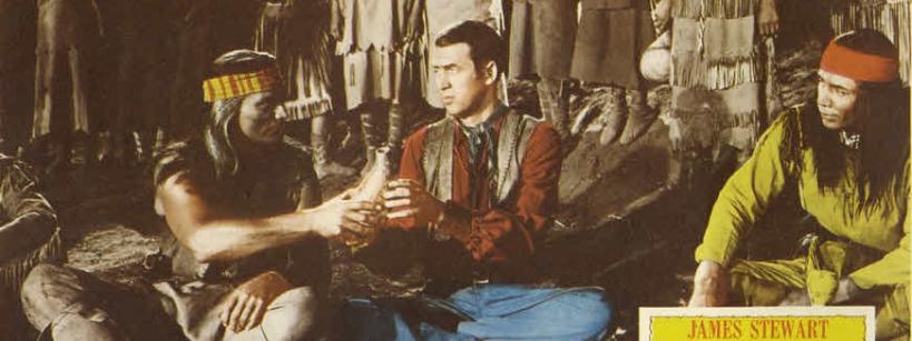 Three men sit on the ground in traditional Native American and Western attire. One man hands a peace pipe to another. A yellow "Broken Arrow" movie poster with James Stewart's name appears in the lower right corner.