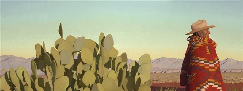 A person wearing a wide-brimmed hat and a red patterned blanket stands beside a large prickly pear cactus in a desert landscape, with distant mountains under a clear sky.