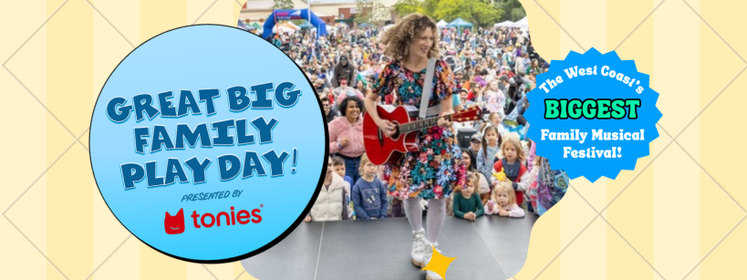 A woman in a floral dress plays guitar and sings on an outdoor stage, entertaining a large audience of families at the Great Big Family Play Day festival, presented by Tonies. Banners announce it as the West Coast’s biggest family musical festival.