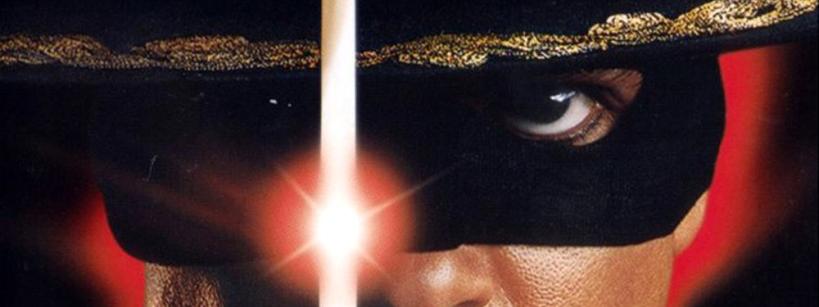 Close-up of a person's face wearing a black mask and hat with gold trim, divided by a bright, glowing sword. One intense eye and part of the hat are vividly visible against a red background.