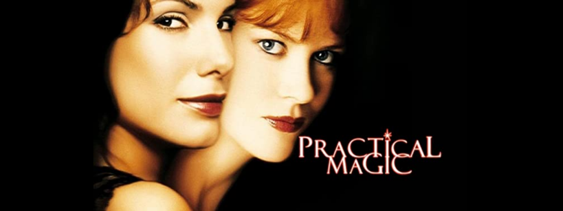 Two women stand close together against a black background. The words "Practical Magic" are written near their faces in stylized white and orange text.