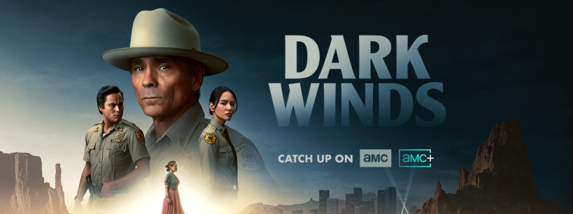 Promotional image for the TV series Dark Winds, featuring three cast members in police uniforms against a desert landscape with the title and AMC streaming information.
