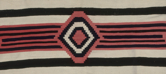 beige textile with stripes and a diamond pattern in black and red